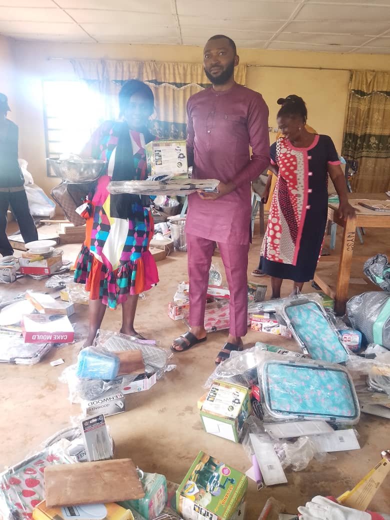 A room filled with Kenwood mixer boxes, cake moulds and catering equipment for beneficiaries