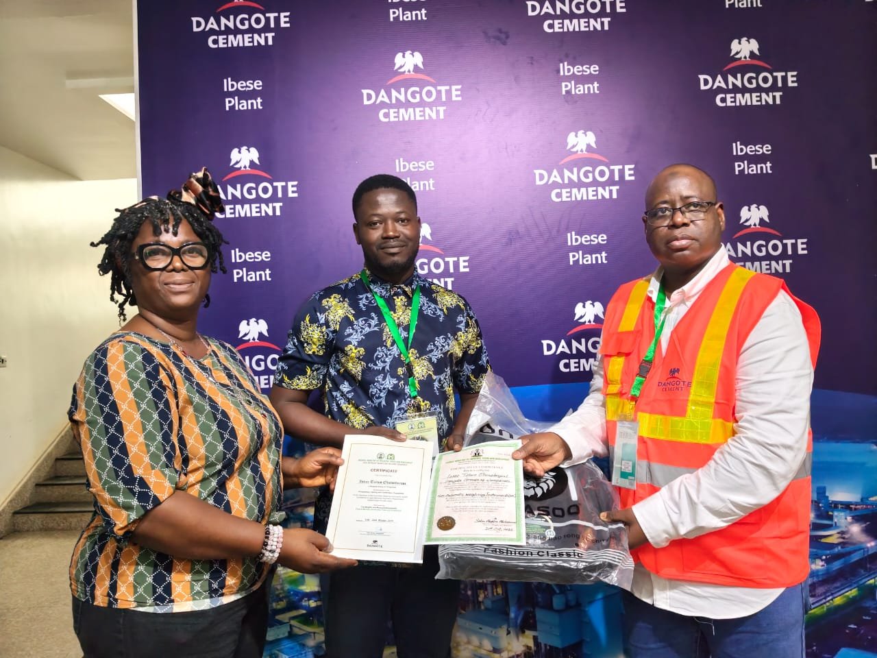 Another participant receives a certificate at the Dangote Cement Ibese Plant weighbridge competency training